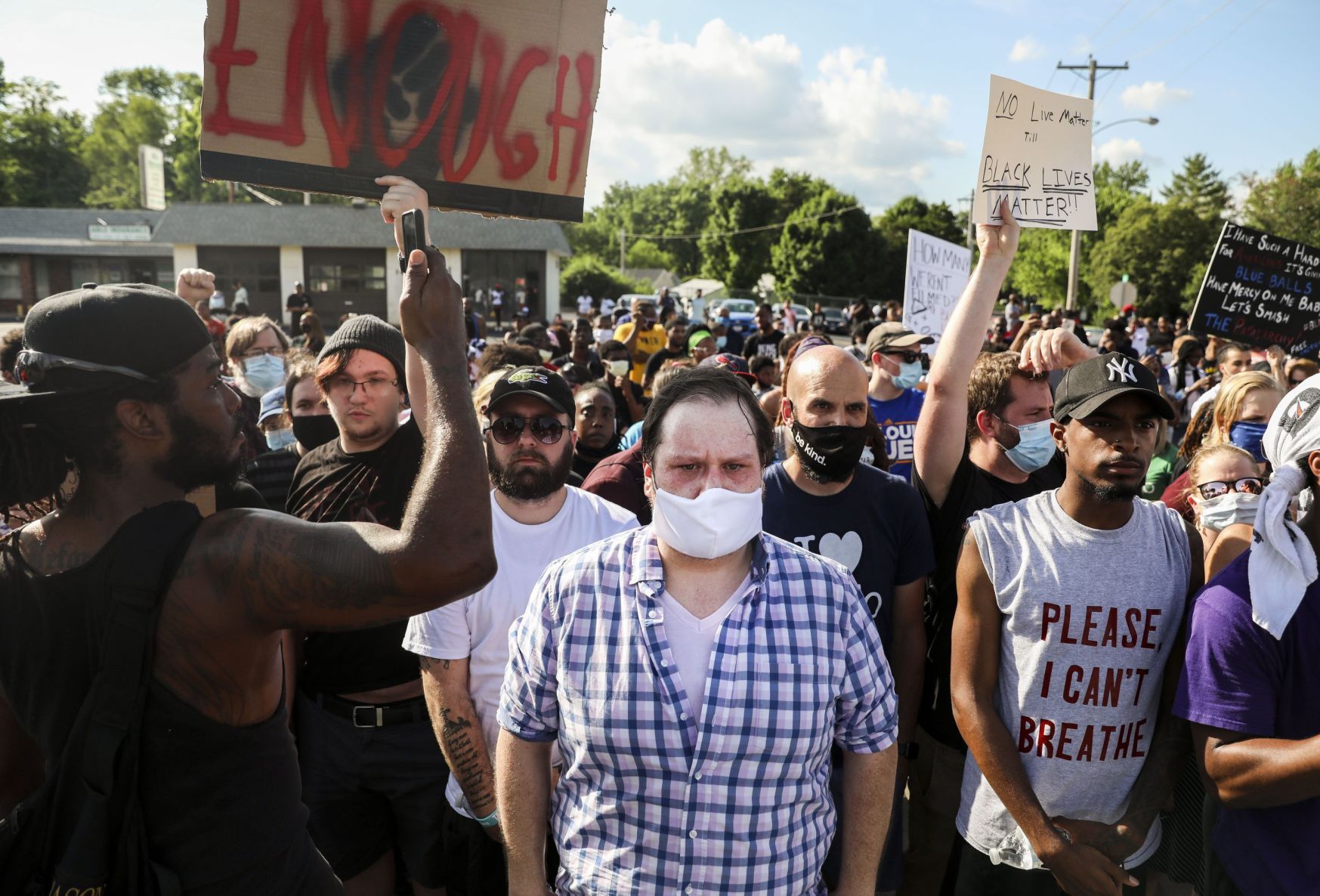Protesters march down Highway 67